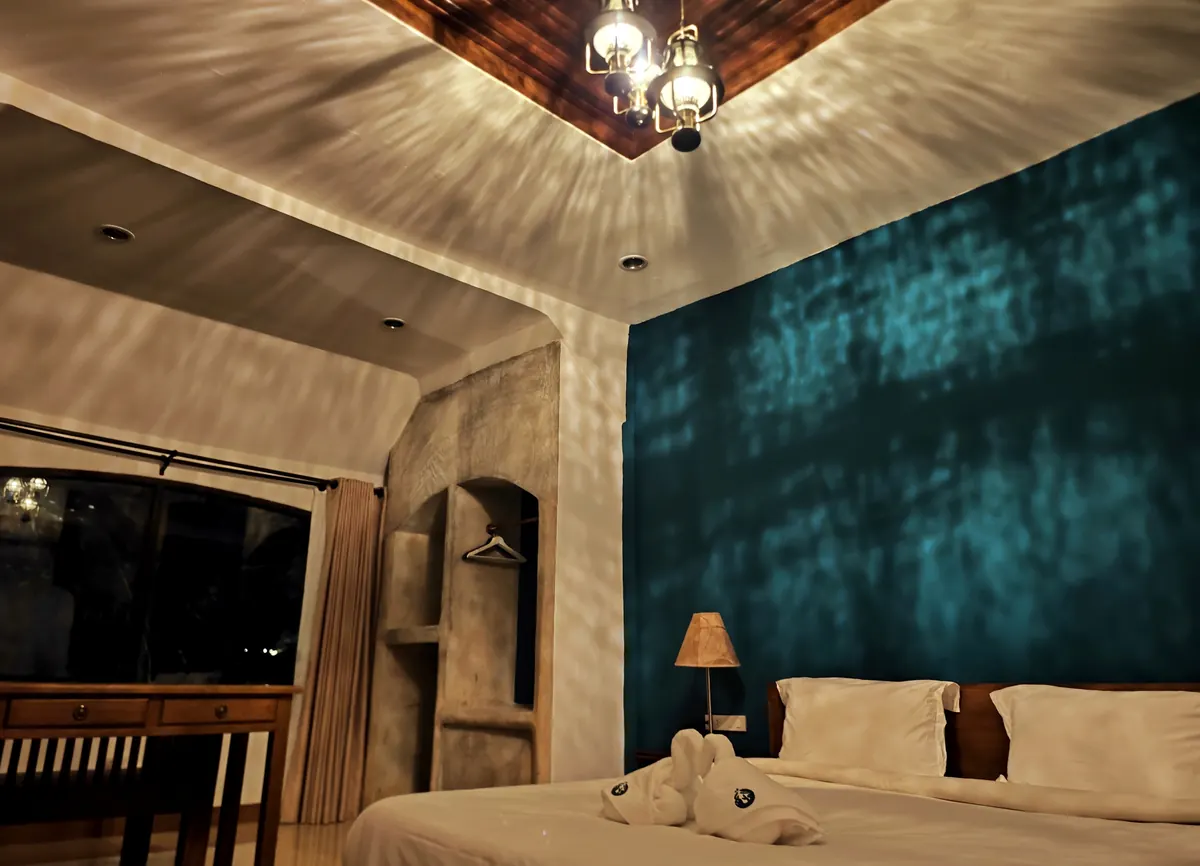King Villa with Terrace — romantic bedroom, king bed dressed for two.