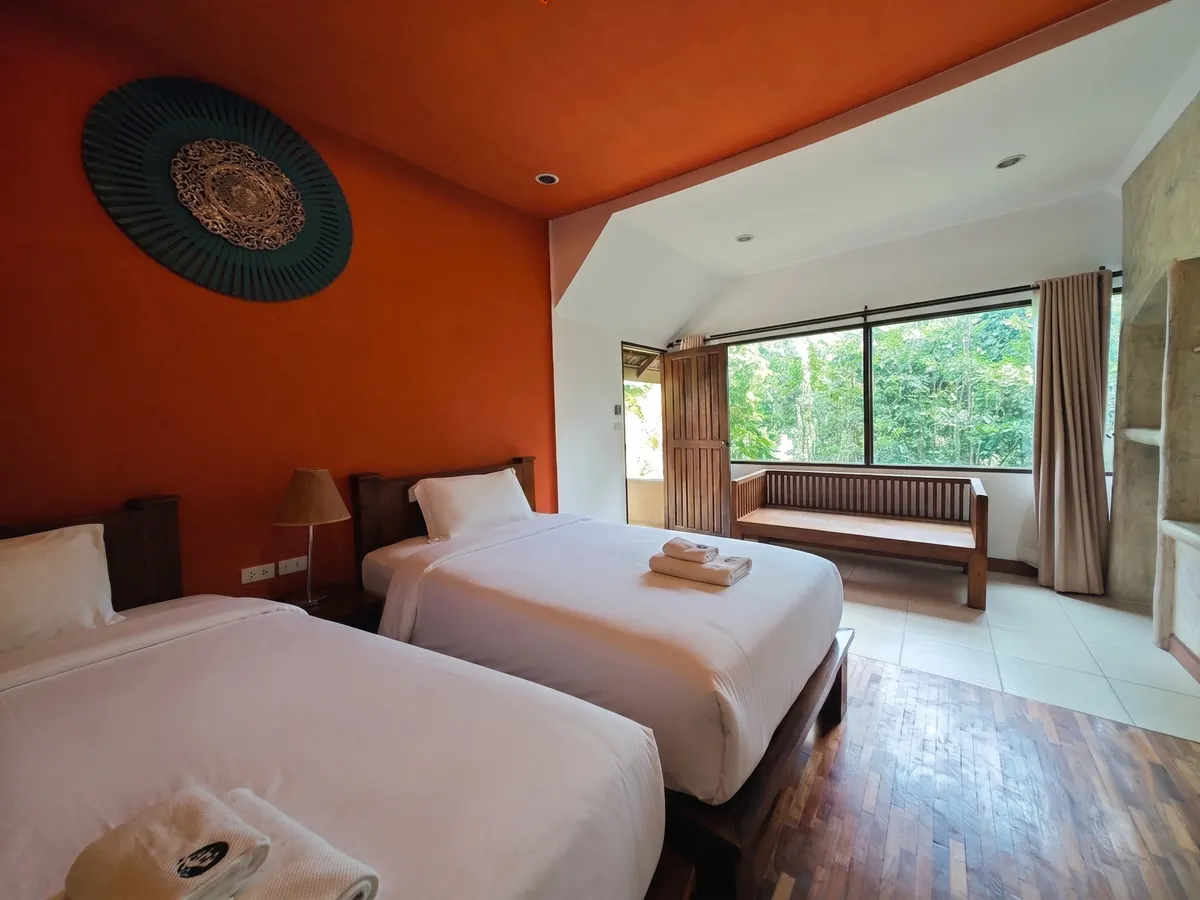 Twin Villa with Garden View — primary bedroom, twin beds.